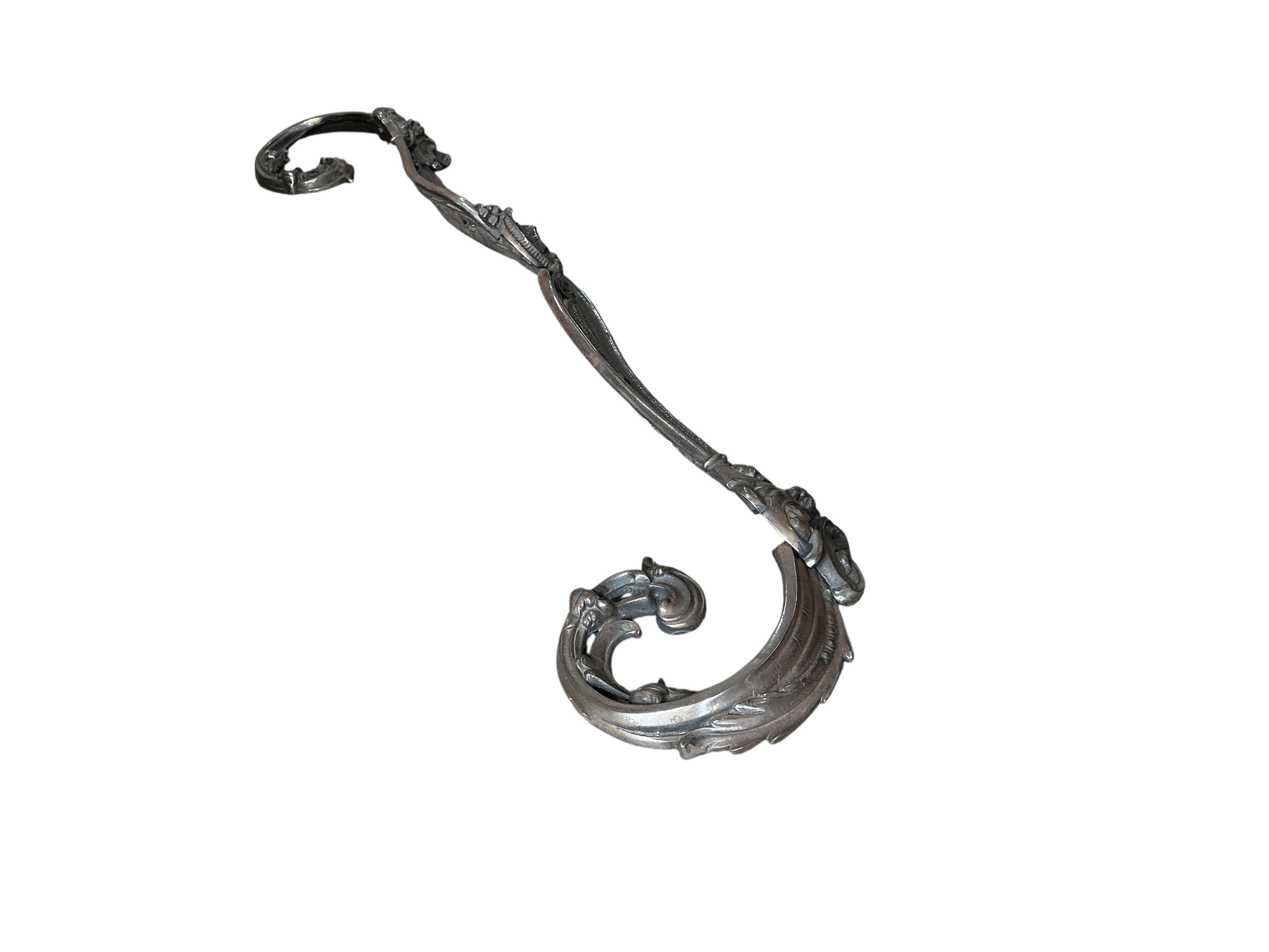 A Victorian polished steel serpentine fender, width 144cm
